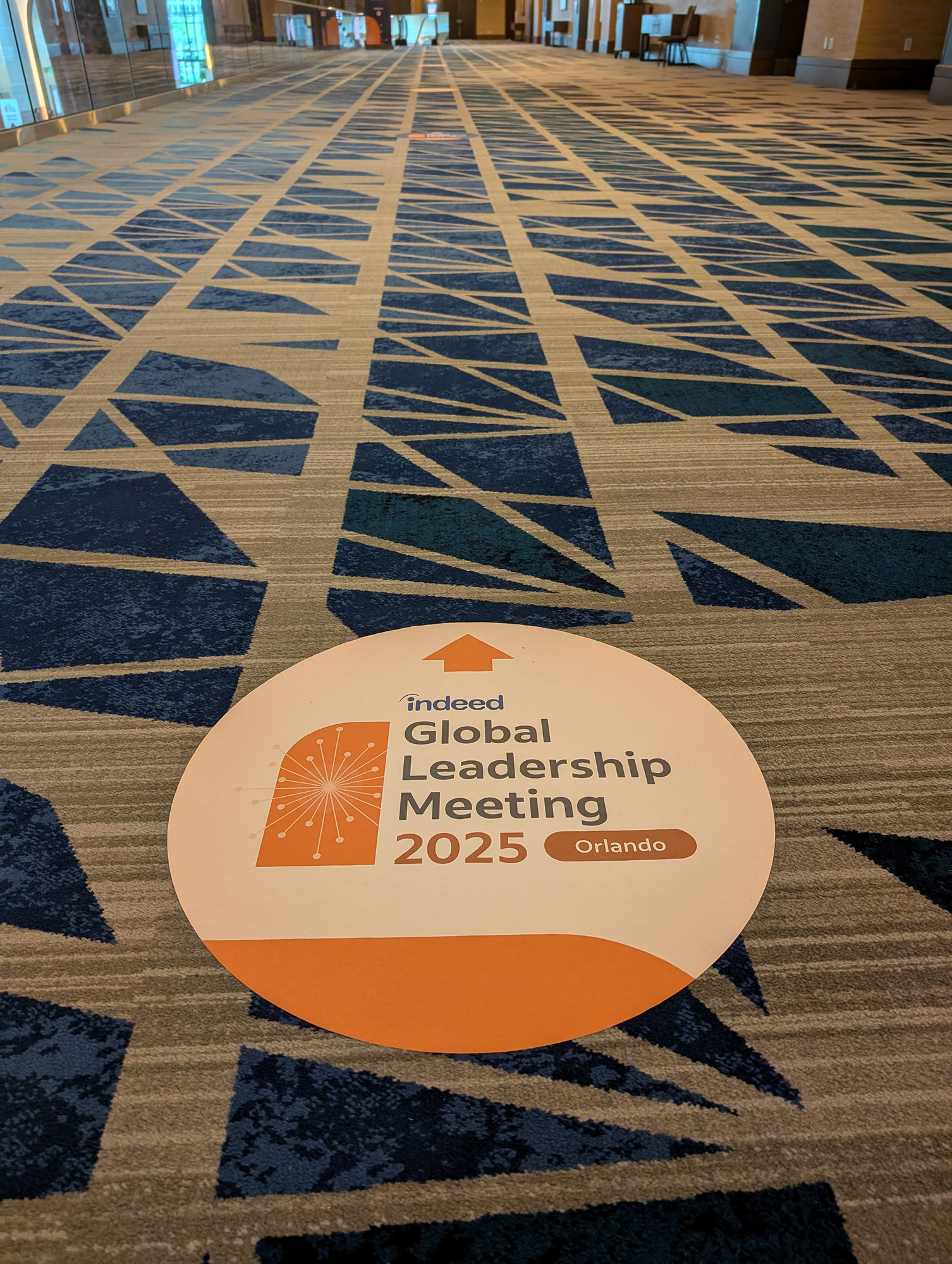 GLM 2025 branded floor decal directional signage