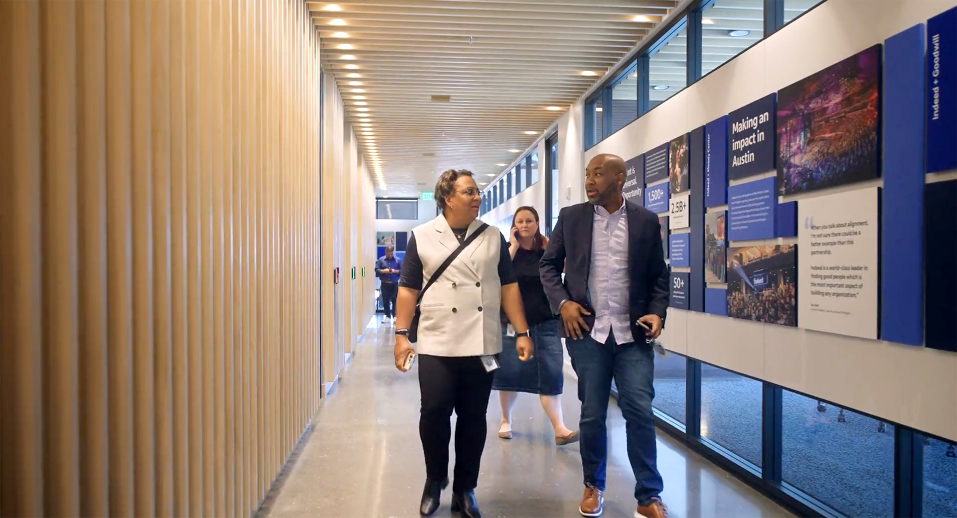 Visitors walking the Idea Center Corridor at Indeed HQ