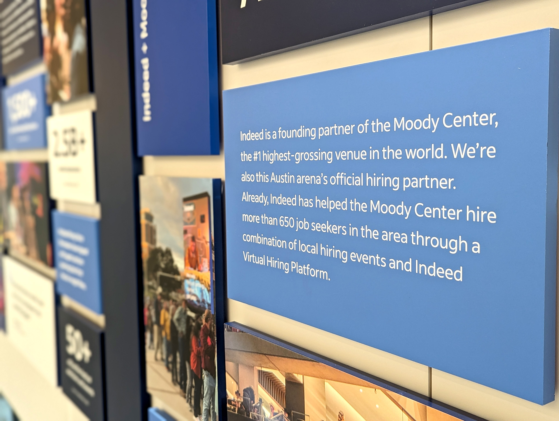 Close-up detail of Idea Center wall panel copy and data