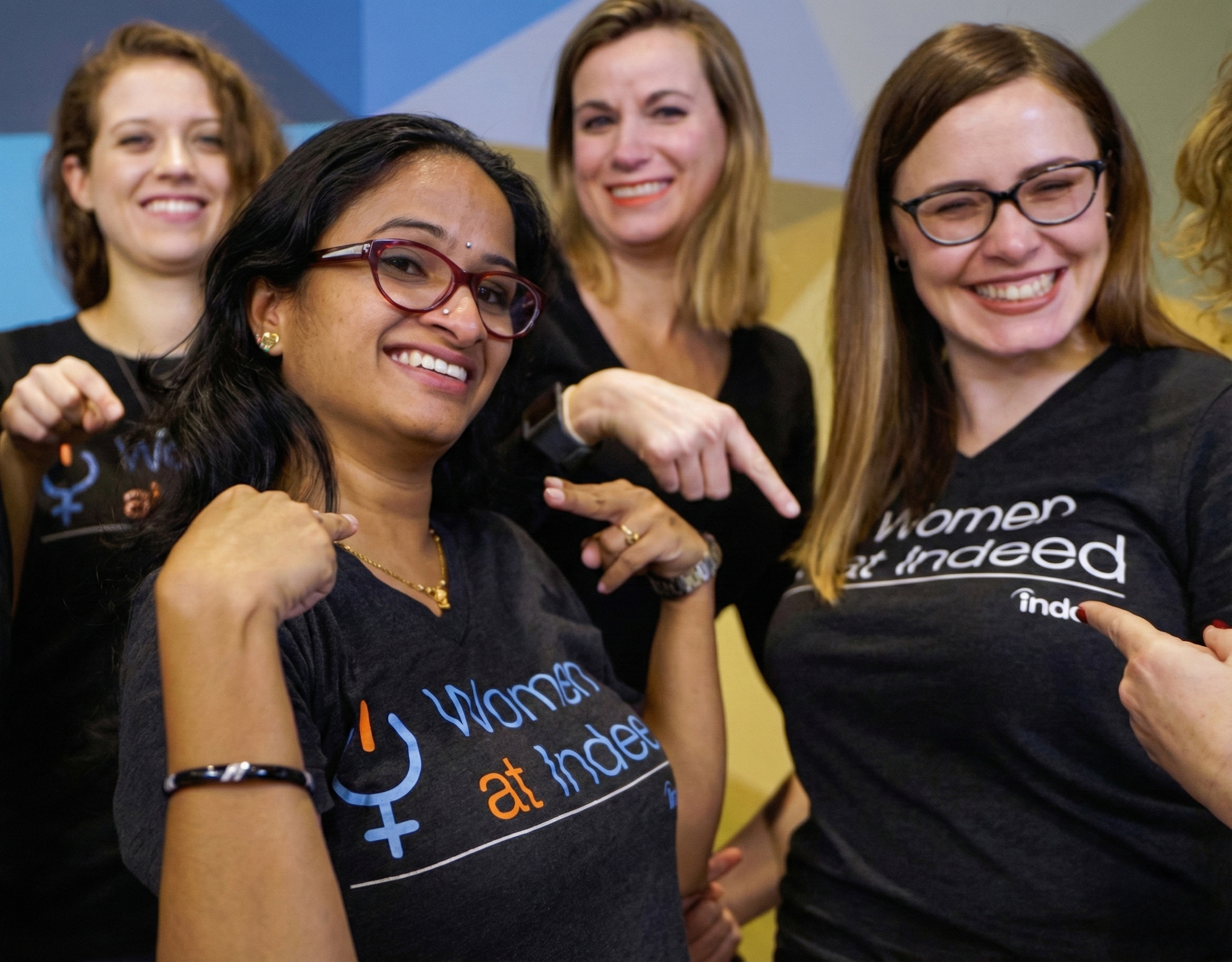 Women at Indeed t-shirts worn by employees