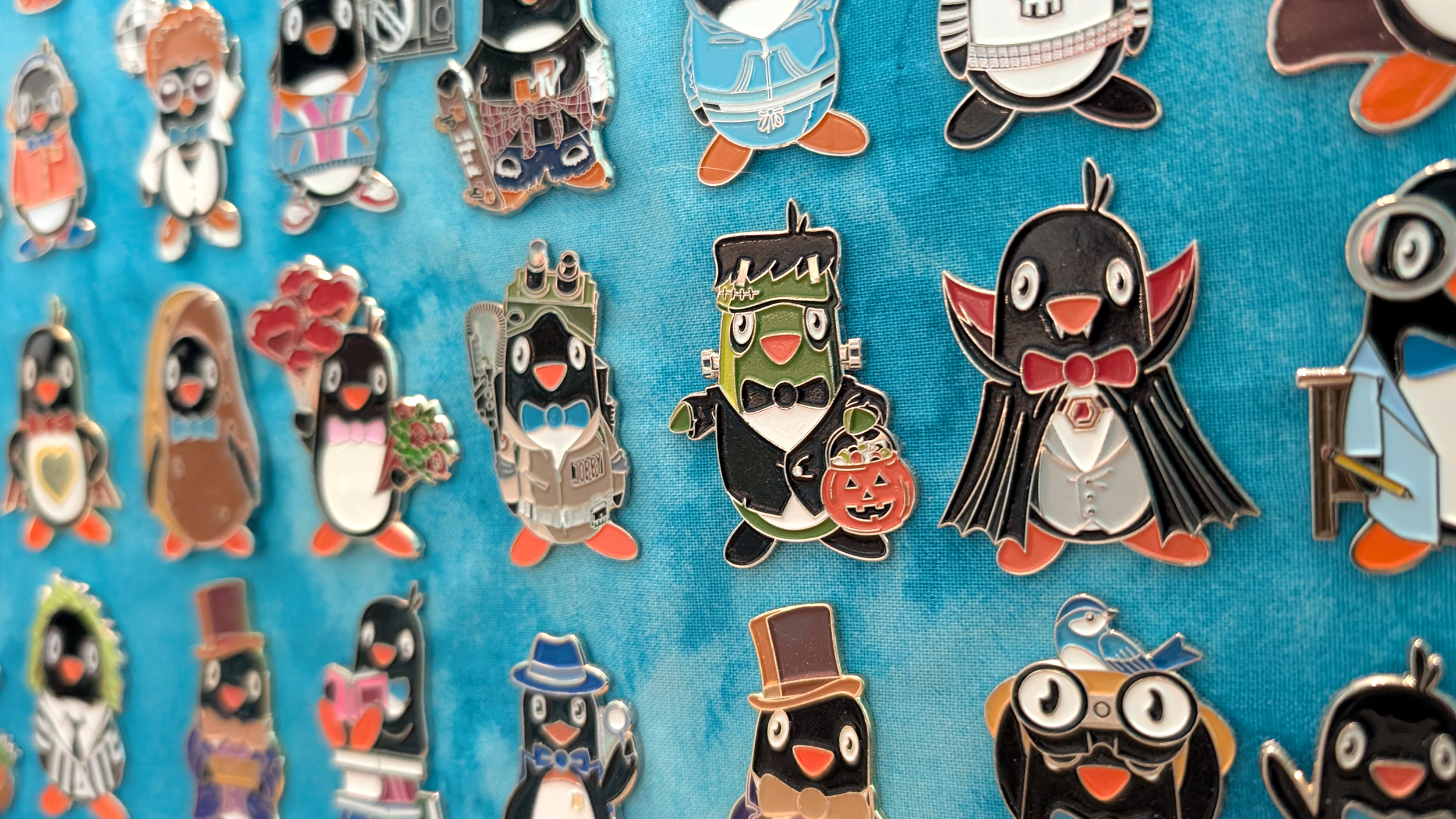 Indeed Jobby penguin enamel pin collection spread